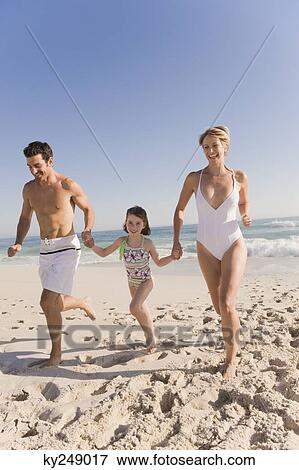 Family enjoying vacations on the beach View Large Photo Image Stock Photo - Family enjoying vacations on the beach. Fotosearch