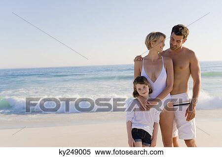 Family standing on the beach View Large Photo Image Stock Photography - Family standing on the beach. Fotosearch