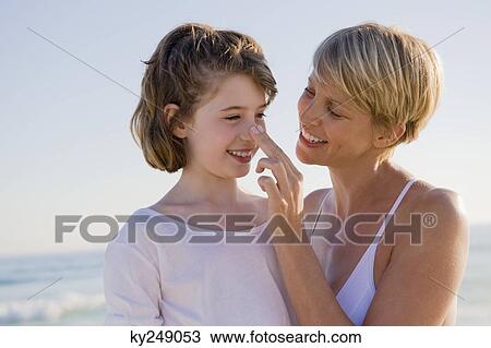 Woman with her daughter enjoying vacations on the beach View Large Photo Image Stock Image - Woman with her daughter enjoying vacations on the beach. Fotosearch