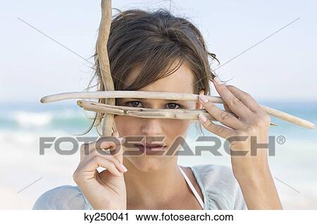 Woman pretending to wear scuba mask with sticks View Large Photo Image Stock Image - Woman pretending to wear scuba mask with sticks. Fotosearch