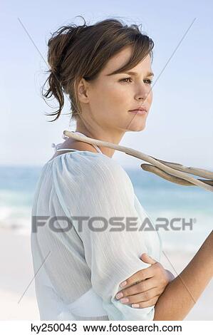 Woman standing on the beach and thinking View Large Photo Image Stock Image - Woman standing on the beach and thinking. Fotosearch