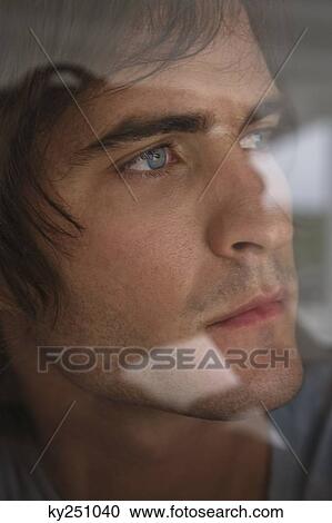 Man looking through glass window View Large Photo Image Stock Image - Man looking through glass window. Fotosearch