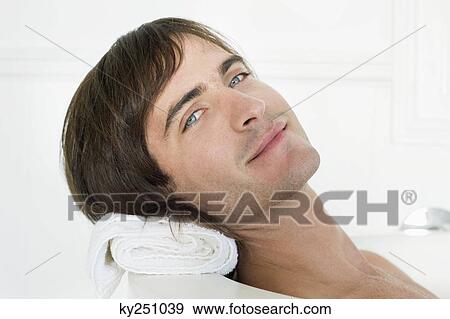 Stock Photo - Portrait of a man in a bathtub. Fotosearch