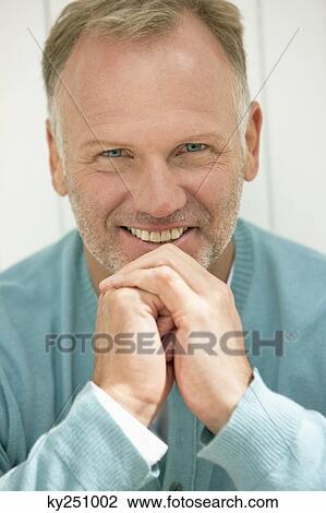 Stock Image - Portrait of a man smiling. Fotosearch