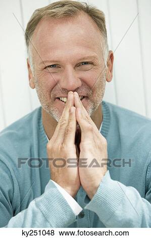 Portrait of a man smiling View Large Photo Image Stock Photo - Portrait of a man smiling. Fotosearch
