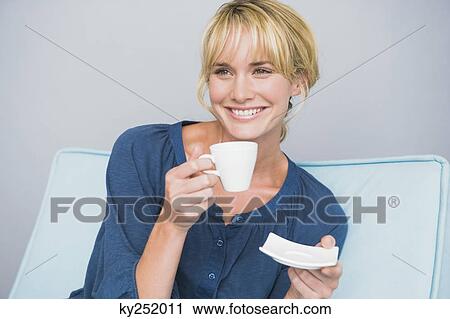 Woman holding a cup of tea View Large Photo Image Stock Image - Woman holding a cup of tea. Fotosearch