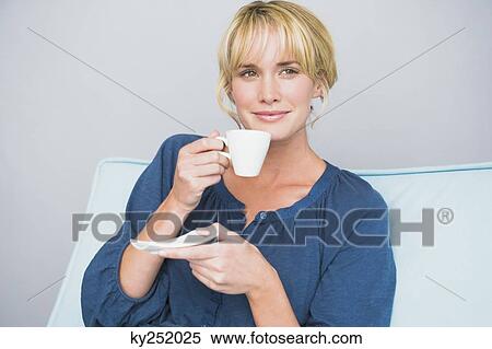 Woman holding a cup of tea View Large Photo Image Stock Photography - Woman holding a cup of tea. Fotosearch