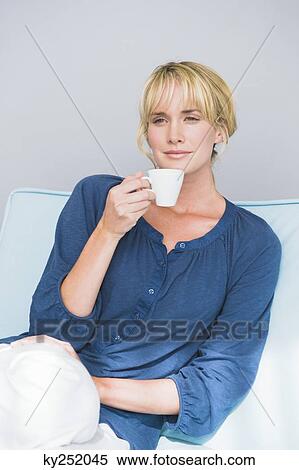 Woman holding a cup of tea View Large Photo Image Stock Photography - Woman holding a cup of tea. Fotosearch