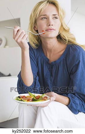 Woman holding a plate of fruit salad View Large Photo Image Stock Image - Woman holding a plate of fruit salad. Fotosearch