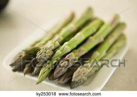 Close-up of asparagus sticks in a tray View Large Photo Image Stock Photo - Close-up of asparagus sticks in a tray. Fotosearch