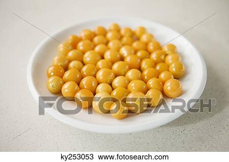 Close-up of cherry tomatoes on a plate View Large Photo Image Stock Image - Close-up of cherry tomatoes on a plate. Fotosearch
