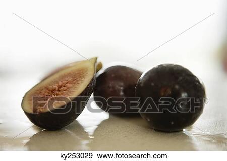 Close-up of figs on a table View Large Photo Image Stock Photo - Close-up of figs on a table. Fotosearch