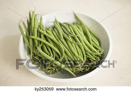 Close-up of green beans on a plate View Large Photo Image Stock Photo - Close-up of green beans on a plate. Fotosearch