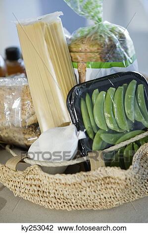 Pasta with peas and bread in a wicker basket View Large Photo Image Stock Image - Pasta with peas and bread in a wicker basket. Fotosearch