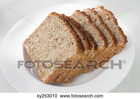 Slices of bread on a plate View Large Photo Image Stock Image - Slices of bread on a plate. Fotosearch