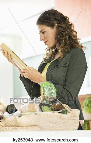 Woman working in the kitchen View Large Photo Image Stock Photo - Woman working in the kitchen. Fotosearch