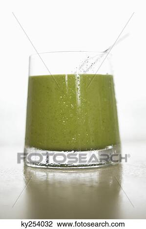 Close-up of a glass of green sauce View Large Photo Image Stock Image - Close-up of a glass of green sauce. Fotosearch