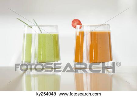 Close-up of two glasses of soups on a dining table View Large Photo Image Stock Photo - Close-up of two glasses of soups on a dining table. Fotosearch