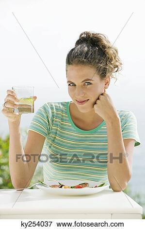 Portrait of a woman having lunch View Large Photo Image Stock Photo - Portrait of a woman having lunch. Fotosearch