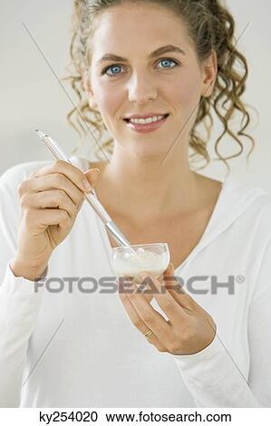 Woman mixing white clay for facial mask View Large Photo Image Stock Image - Woman mixing white clay for facial mask. Fotosearch
