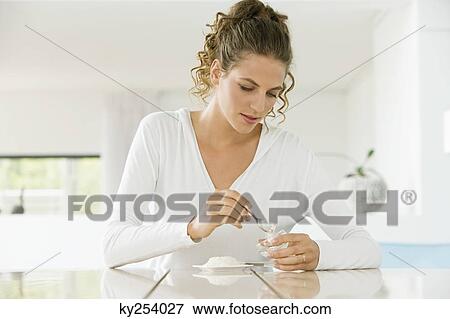 Woman mixing white clay for facial mask View Large Photo Image Stock Photo - Woman mixing white clay for facial mask. Fotosearch