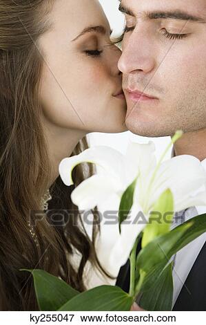 Bride kissing groom View Large Photo Image Stock Photo - Bride kissing groom. Fotosearch