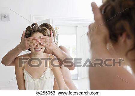 Man covering woman's eyes from behind View Large Photo Image Stock Image - Man covering woman's eyes from behind. Fotosearch