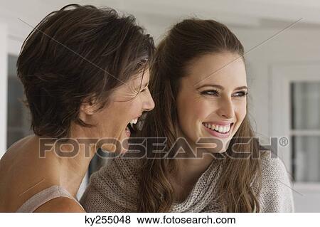 Stock Photo - Two women smiling. Fotosearch
