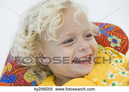 Girl lying and smiling View Large Photo Image Stock Photography - Girl lying and smiling. Fotosearch
