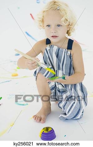 Girl painting on her palm View Large Photo Image Stock Image - Girl painting on her palm. Fotosearch