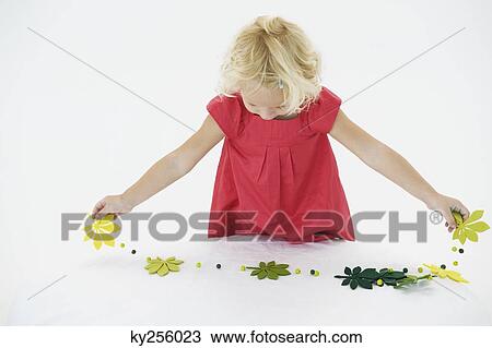 Girl playing with a streamer View Large Photo Image Stock Image - Girl playing with a streamer. Fotosearch