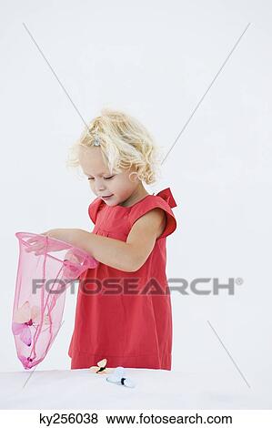 Girl playing with artificial butterflies View Large Photo Image Stock Photo - Girl playing with artificial butterflies. Fotosearch