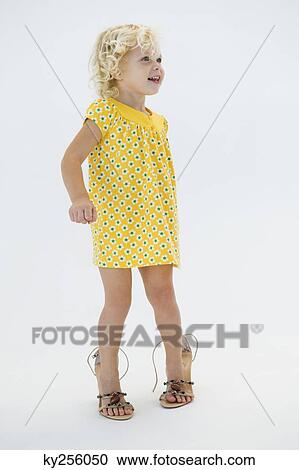 Girl wearing high heels and smiling View Large Photo Image Stock Image - Girl wearing high heels and smiling. Fotosearch