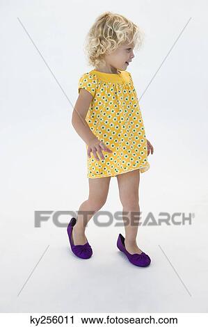 Girl wearing shoes and walking View Large Photo Image Stock Image - Girl wearing shoes and walking. Fotosearch