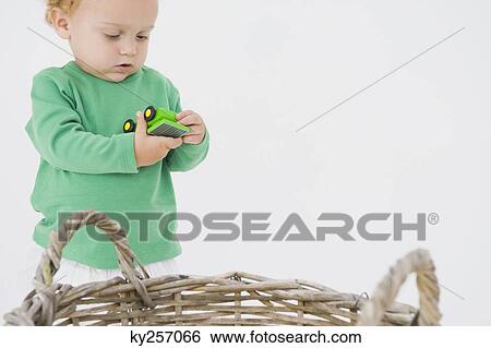 Baby boy holding a toy car View Large Photo Image Stock Photograph - Baby boy holding a toy car. Fotosearch