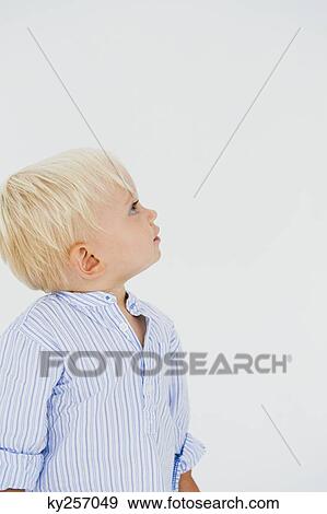 Stock Photo - Baby boy looking up. Fotosearch