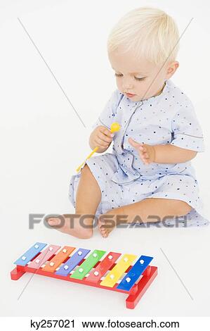 Baby boy playing with a xylophone View Large Photo Image Stock Image - Baby boy playing with a xylophone. Fotosearch