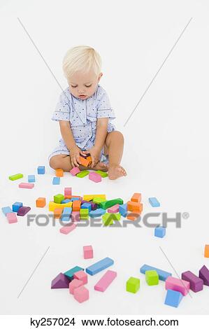 Baby boy playing with blocks View Large Photo Image Picture - Baby boy playing with blocks. Fotosearch