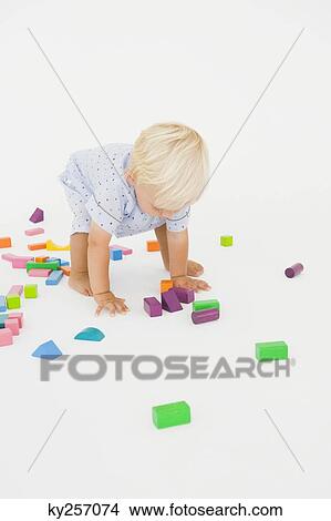 Baby boy playing with blocks View Large Photo Image Picture - Baby boy playing with blocks. Fotosearch