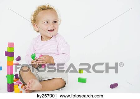 Baby boy playing with blocks View Large Photo Image Stock Image - Baby boy playing with blocks. Fotosearch