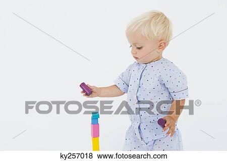 Baby boy playing with blocks View Large Photo Image Stock Photo - Baby boy playing with blocks. Fotosearch