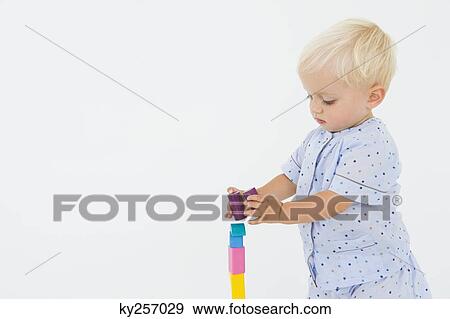 Stock Photo - Baby boy playing with blocks. Fotosearch