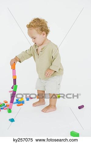 Baby boy playing with blocks View Large Photo Image Stock Photography - Baby boy playing with blocks. Fotosearch