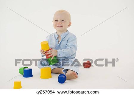 Baby boy stacking blocks View Large Photo Image Picture - Baby boy stacking blocks. Fotosearch