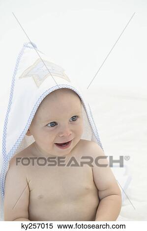 Baby boy wearing a baby blanket View Large Photo Image Stock Photography - Baby boy wearing a baby blanket. Fotosearch