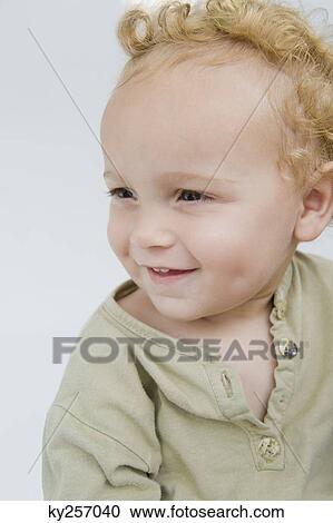 Close-up of a baby boy smiling View Large Photo Image Stock Image - Close-up of a baby boy smiling. Fotosearch