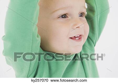 Close-up of a baby boy smiling View Large Photo Image Stock Image - Close-up of a baby boy smiling. Fotosearch