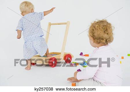 Stock Photo - Close-up of two baby boys. Fotosearch