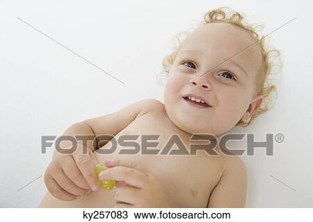 High angle view of a baby boy smiling View Large Photo Image Stock Image - High angle view of a baby boy smiling. Fotosearch