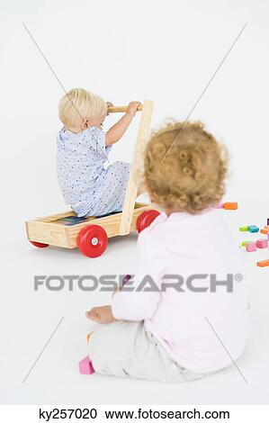 Two baby boys playing View Large Photo Image Stock Image - Two baby boys playing. Fotosearch